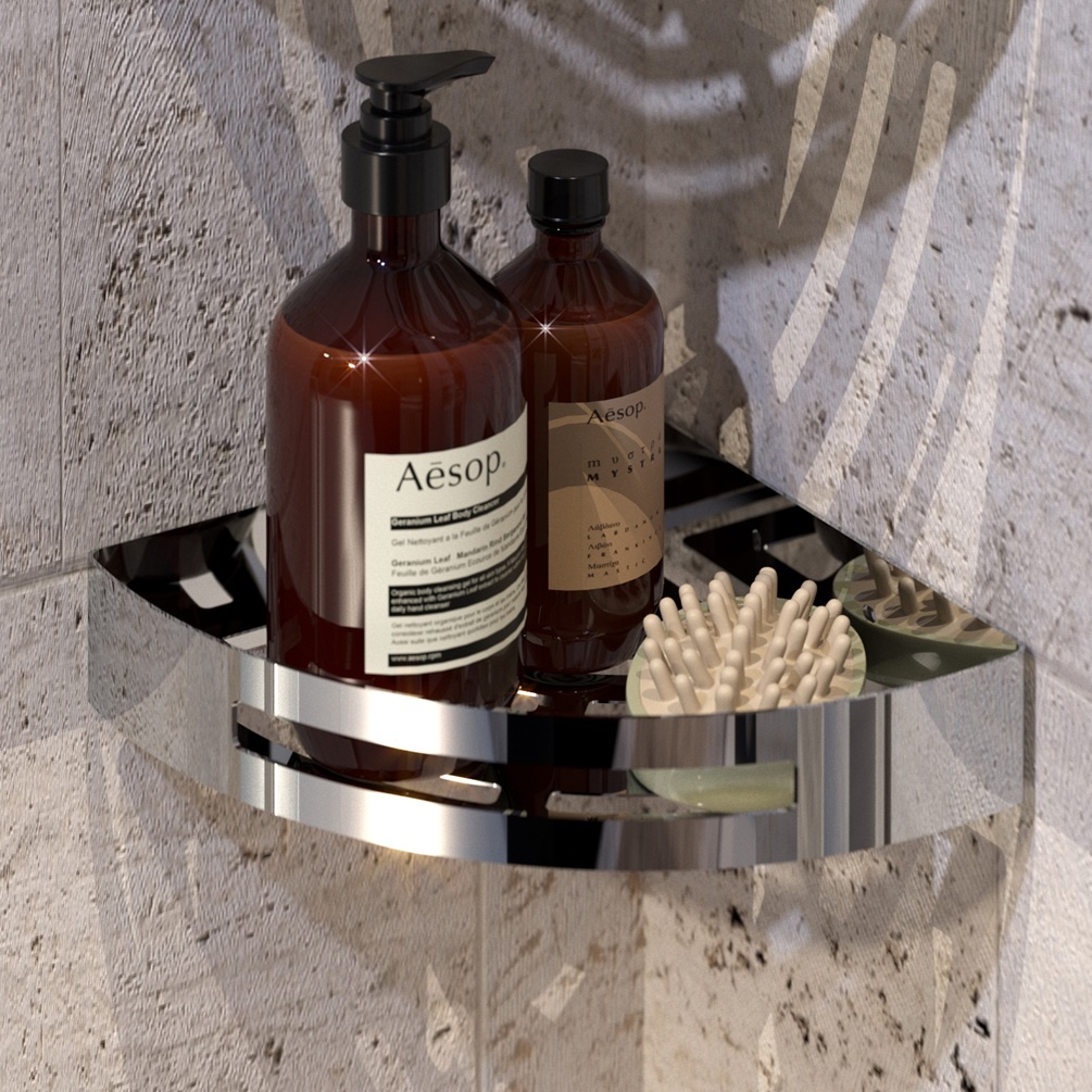 Lifestyle image of Origins Living Gedy Nerva Corner Shower Basket chrome mounted on textured cream wall.